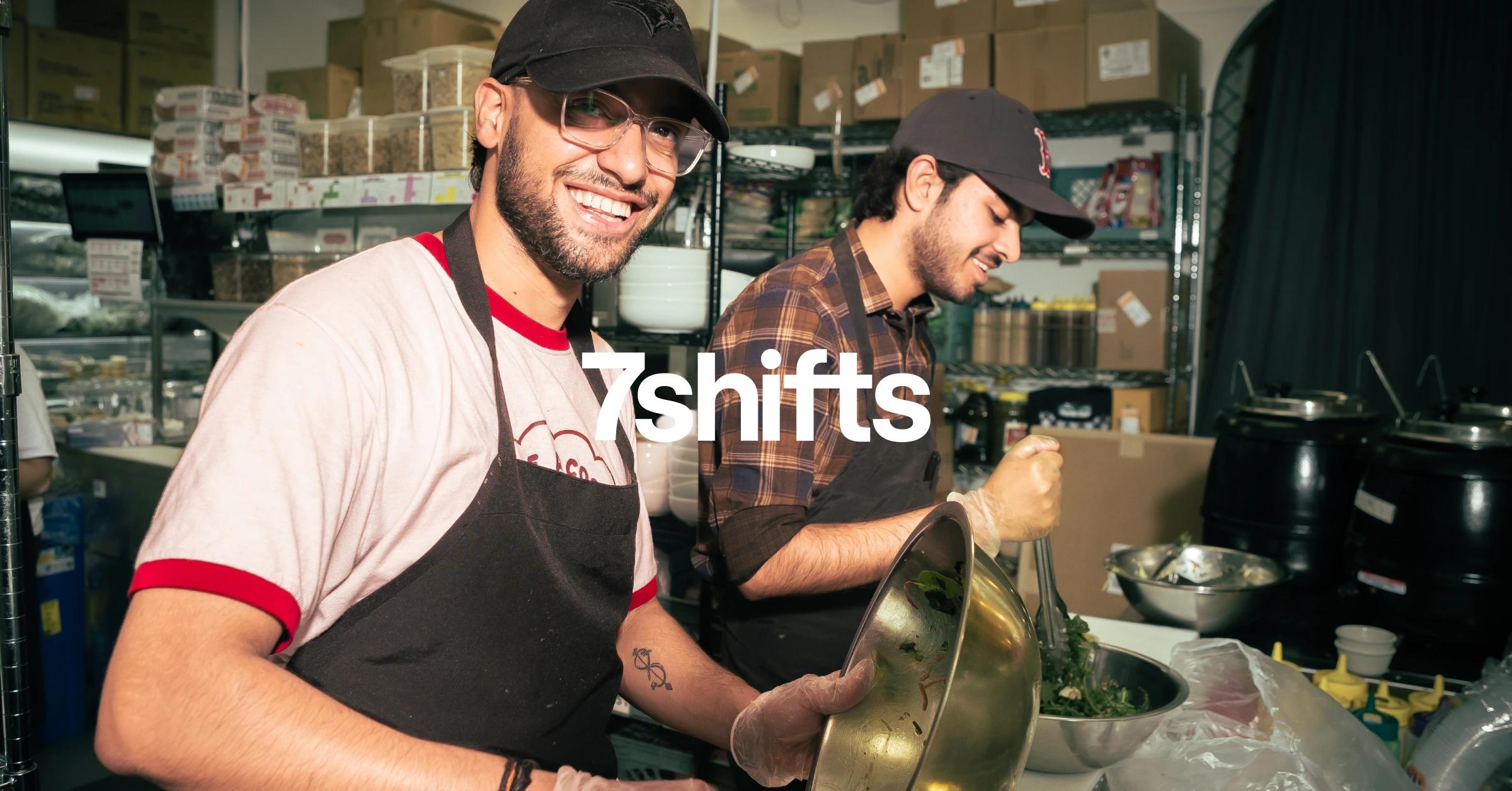 Image of back of house team laughing and washing dishes