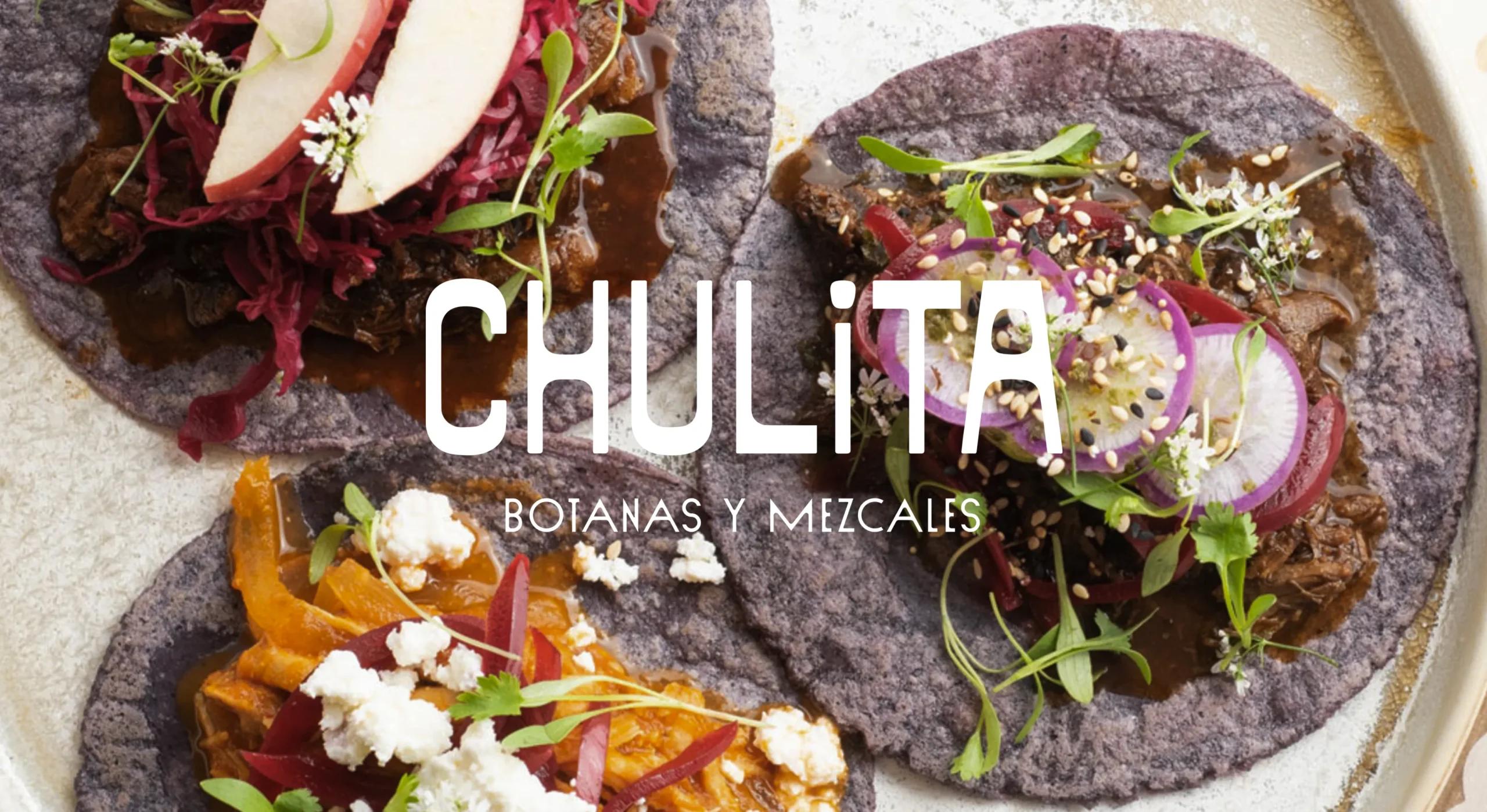 Black tortilla tacos on table with Chulita logo overlay