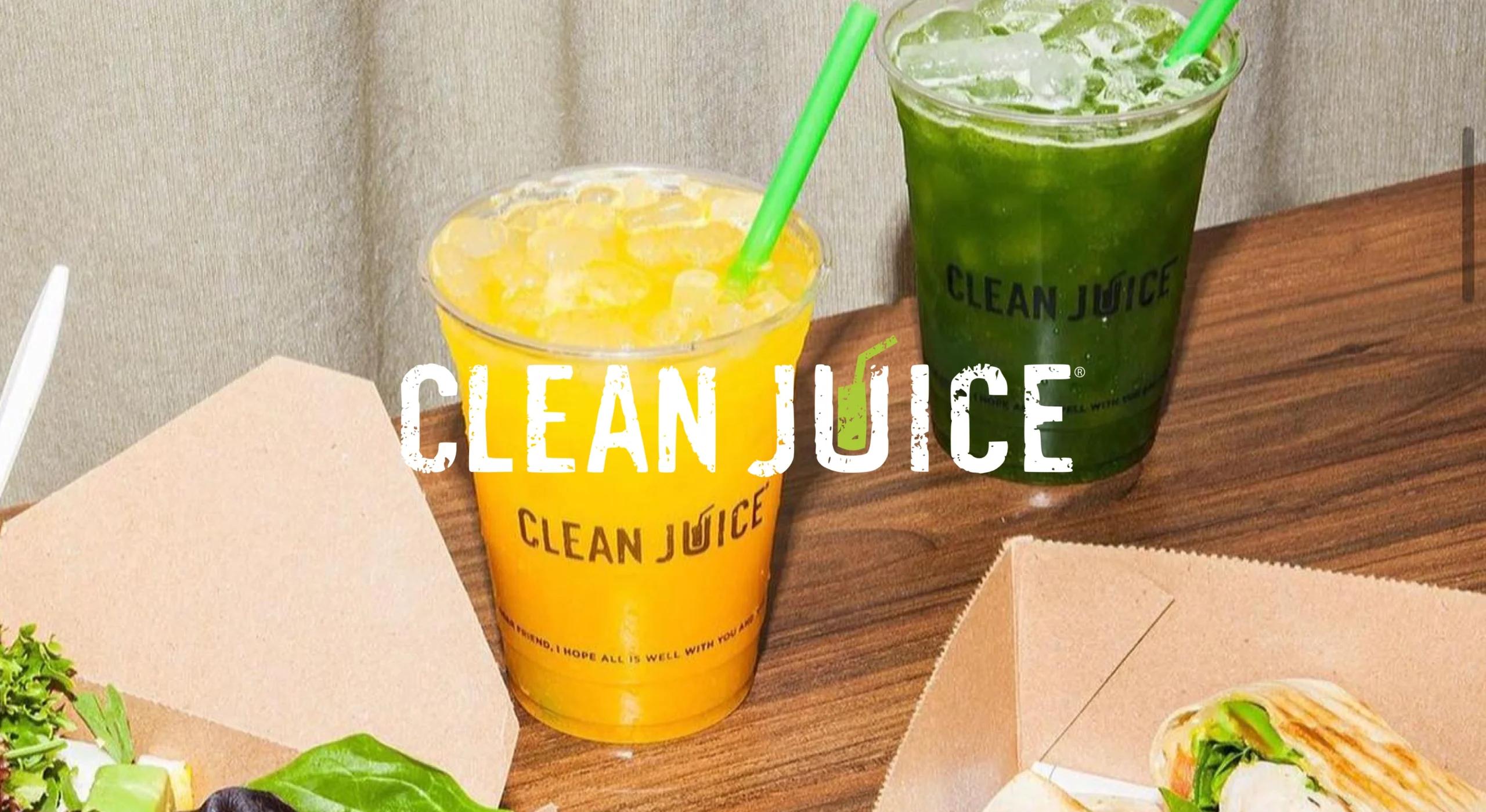 Clean Juice smoothies on table with takeout boxes