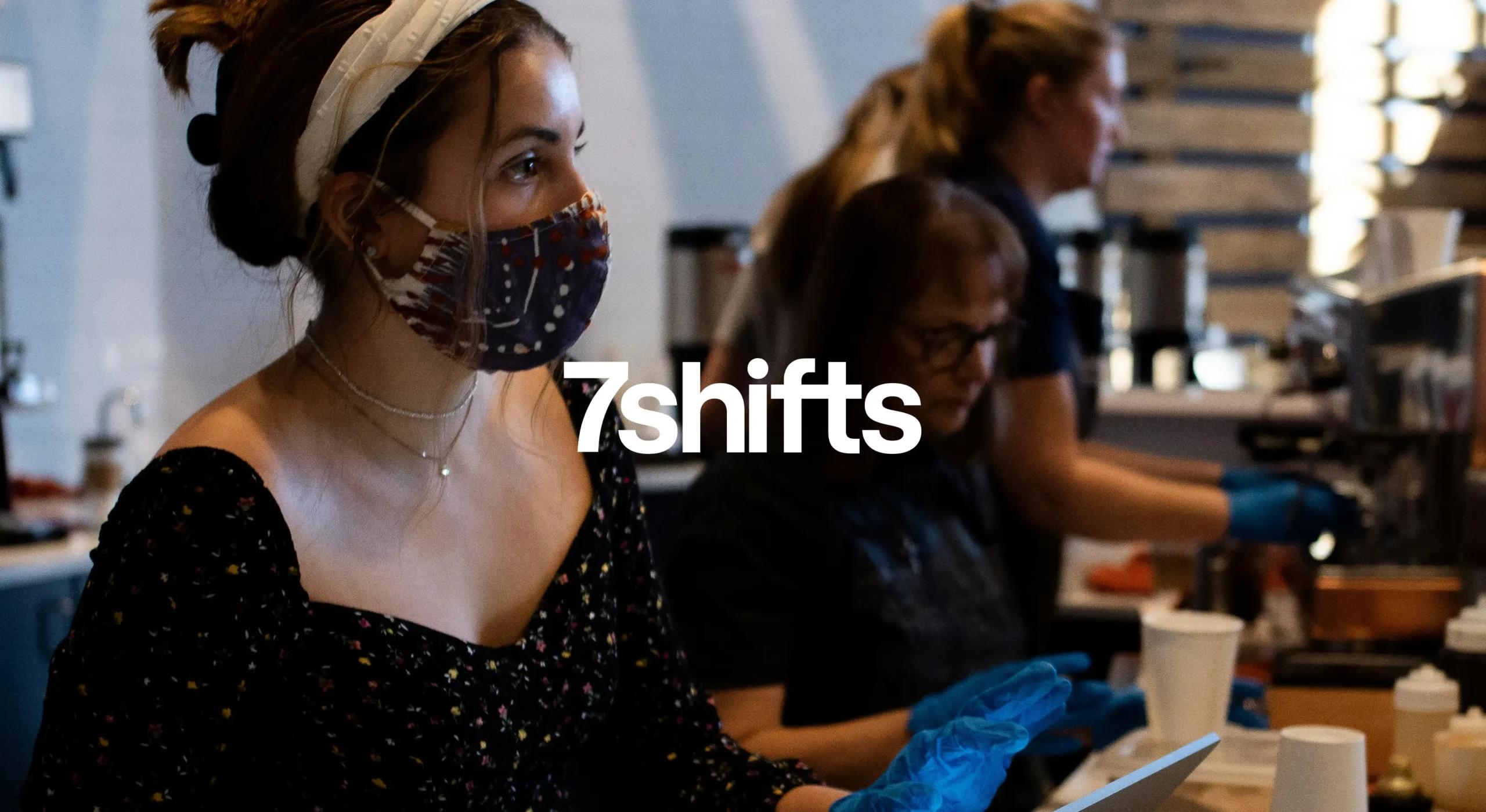 Restaurant workers wearing masks during covid and serving customers