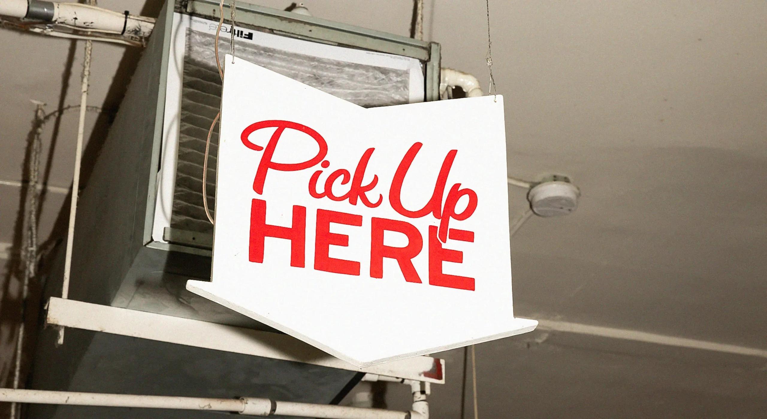 Photo of 'pick up here' sign in a restaurant