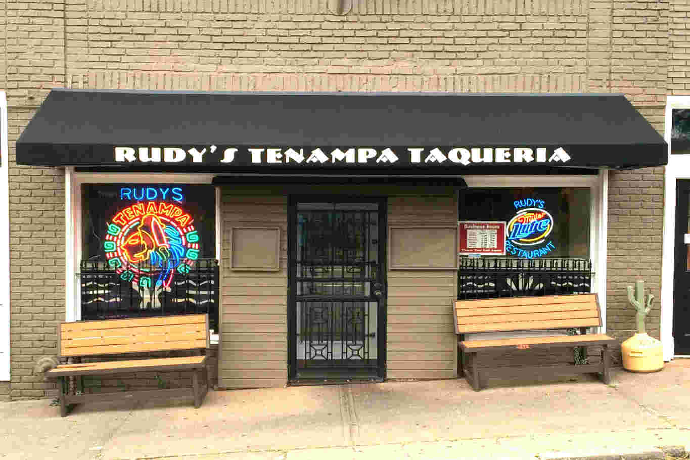 Front of Rudy's Tenampa Taqueria with benches.