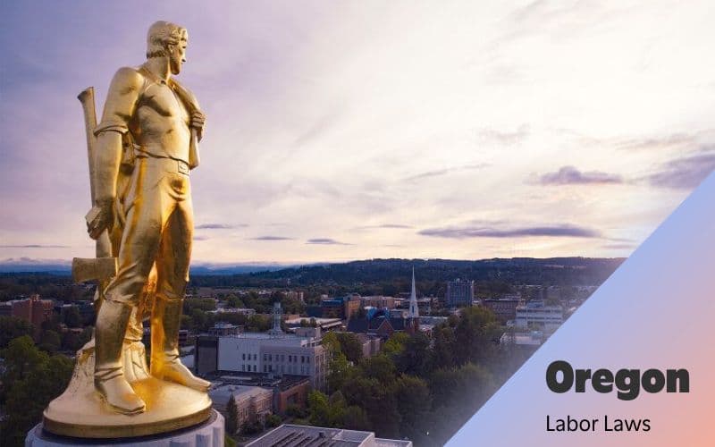 Oregon labor laws statue and cityscape skyline