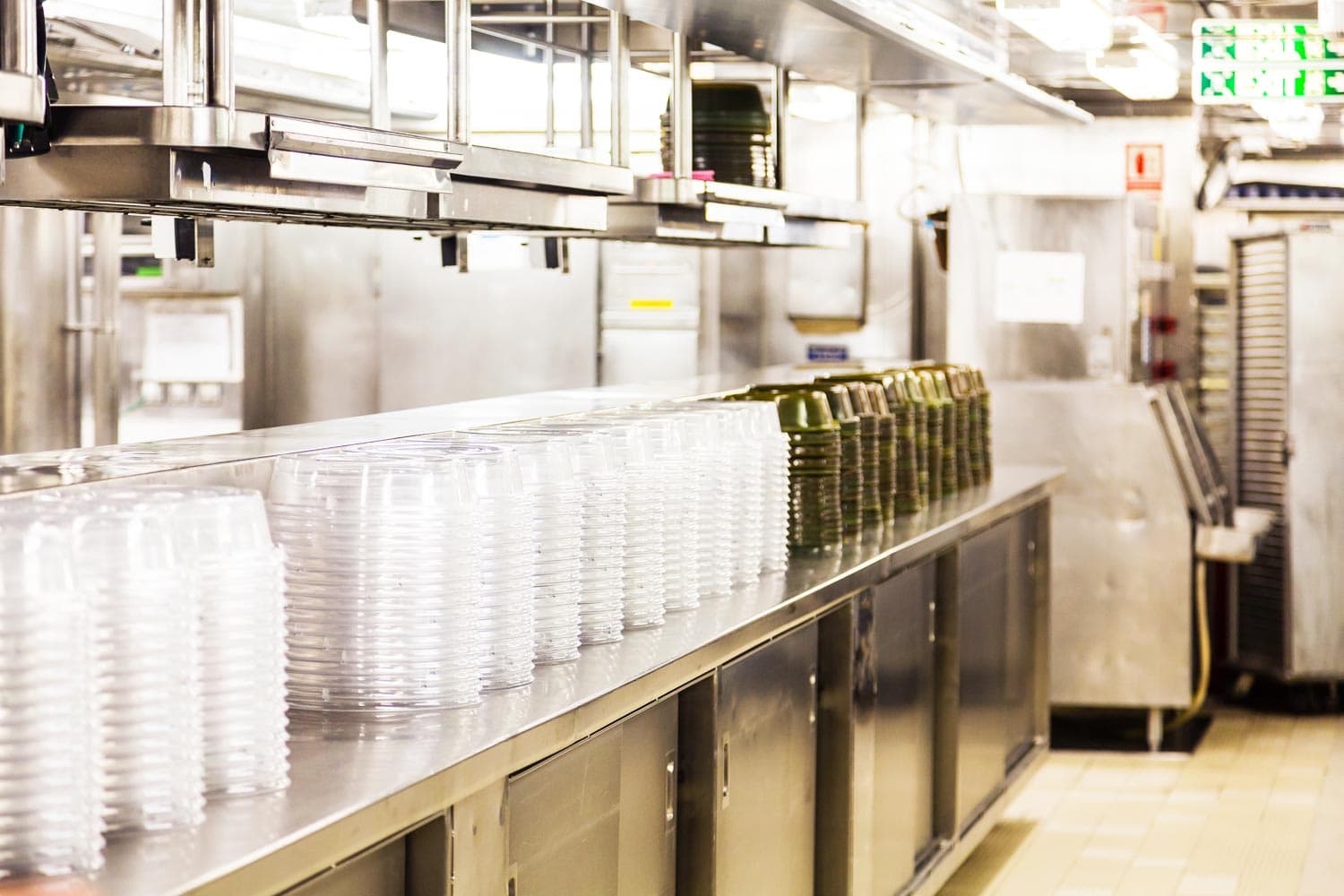 Stacked trays in industrial kitchen workspace